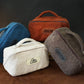 Interior of sherpa toiletry bag, spacious compartment for skincare