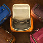 Natural leather cosmetic bag with warm patina, artisan craftsmanship