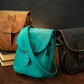 Three leather bags with personalized names on a dark background