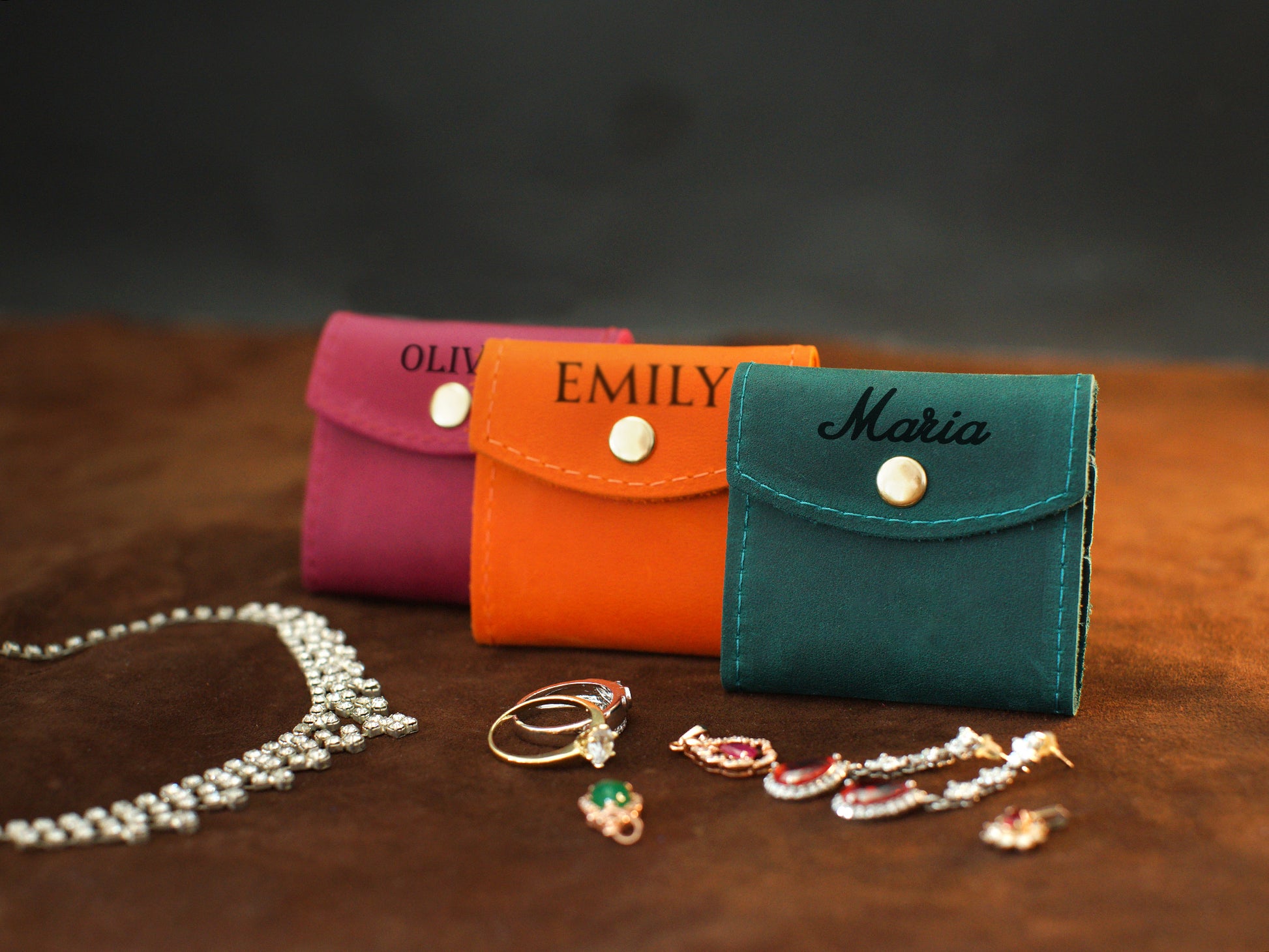Leather jewelry pouch interior pockets detail, organized travel case