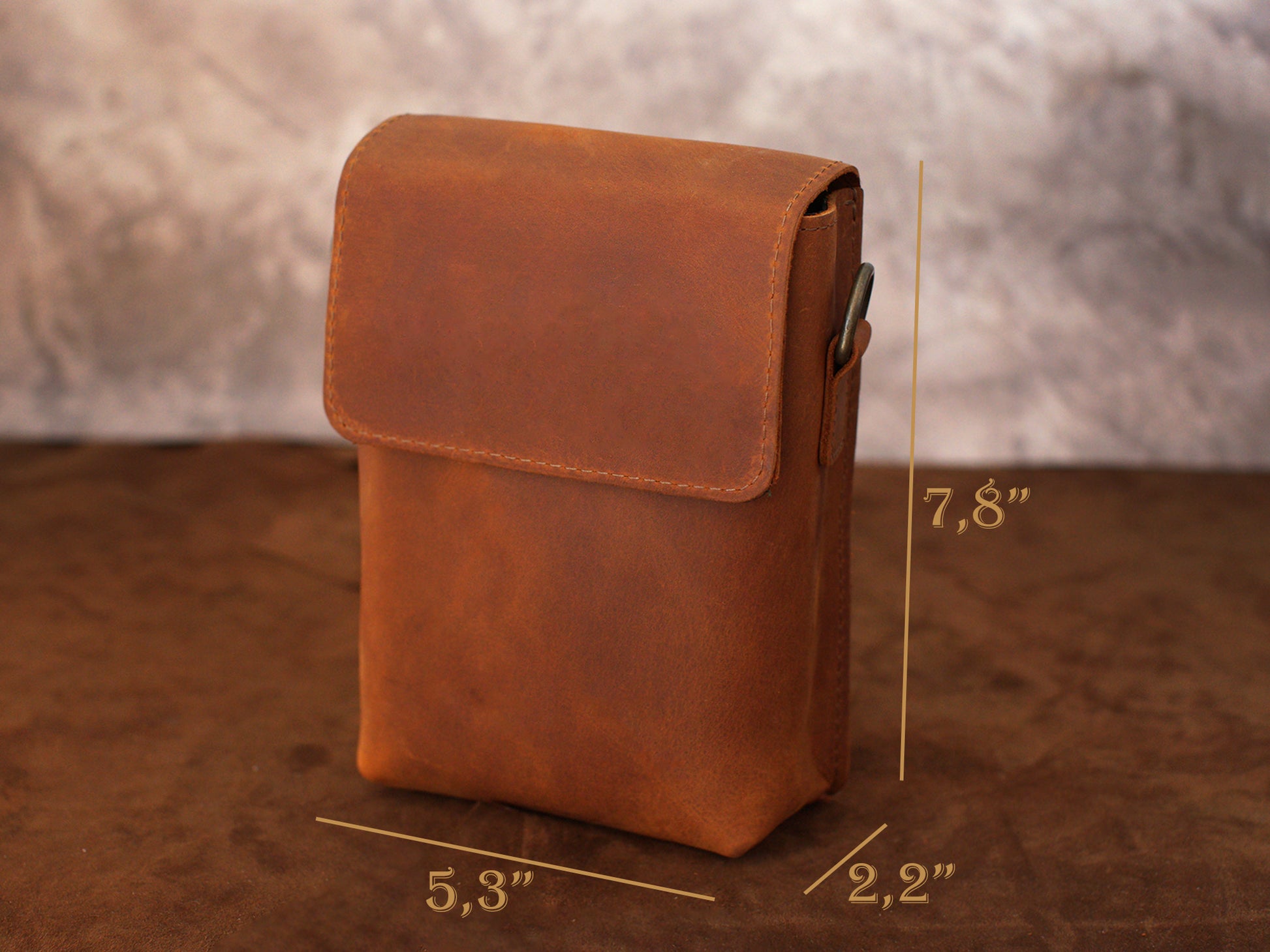 Natural leather crossbody bag with warm patina, artisan craftsmanship