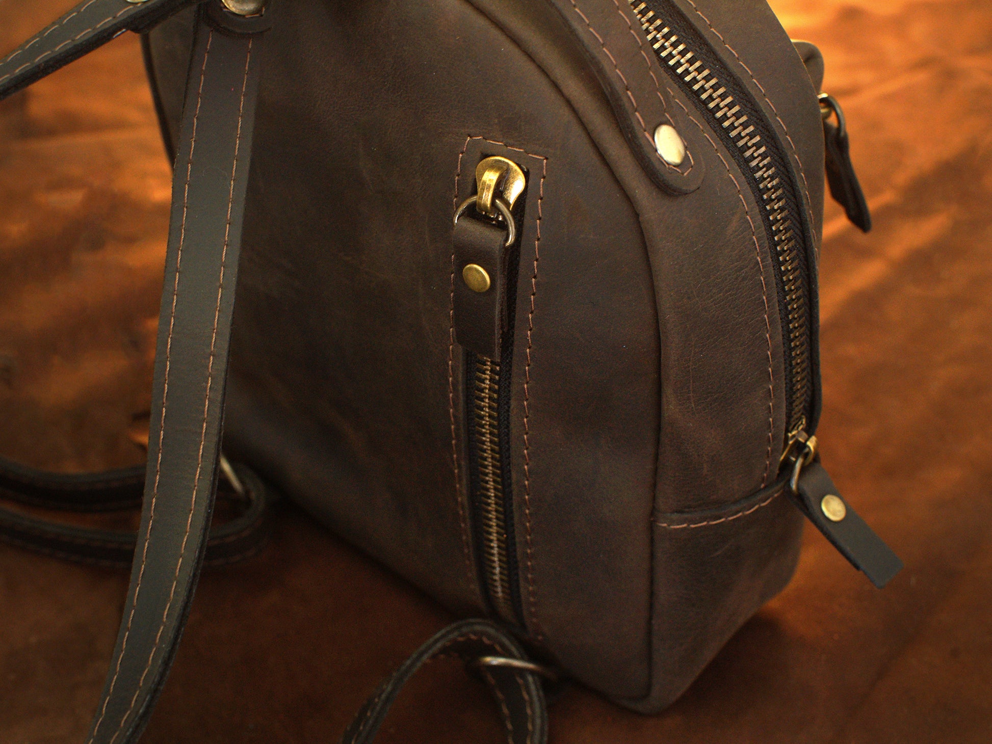 Personalized monogram engraving on handcrafted leather mini backpack