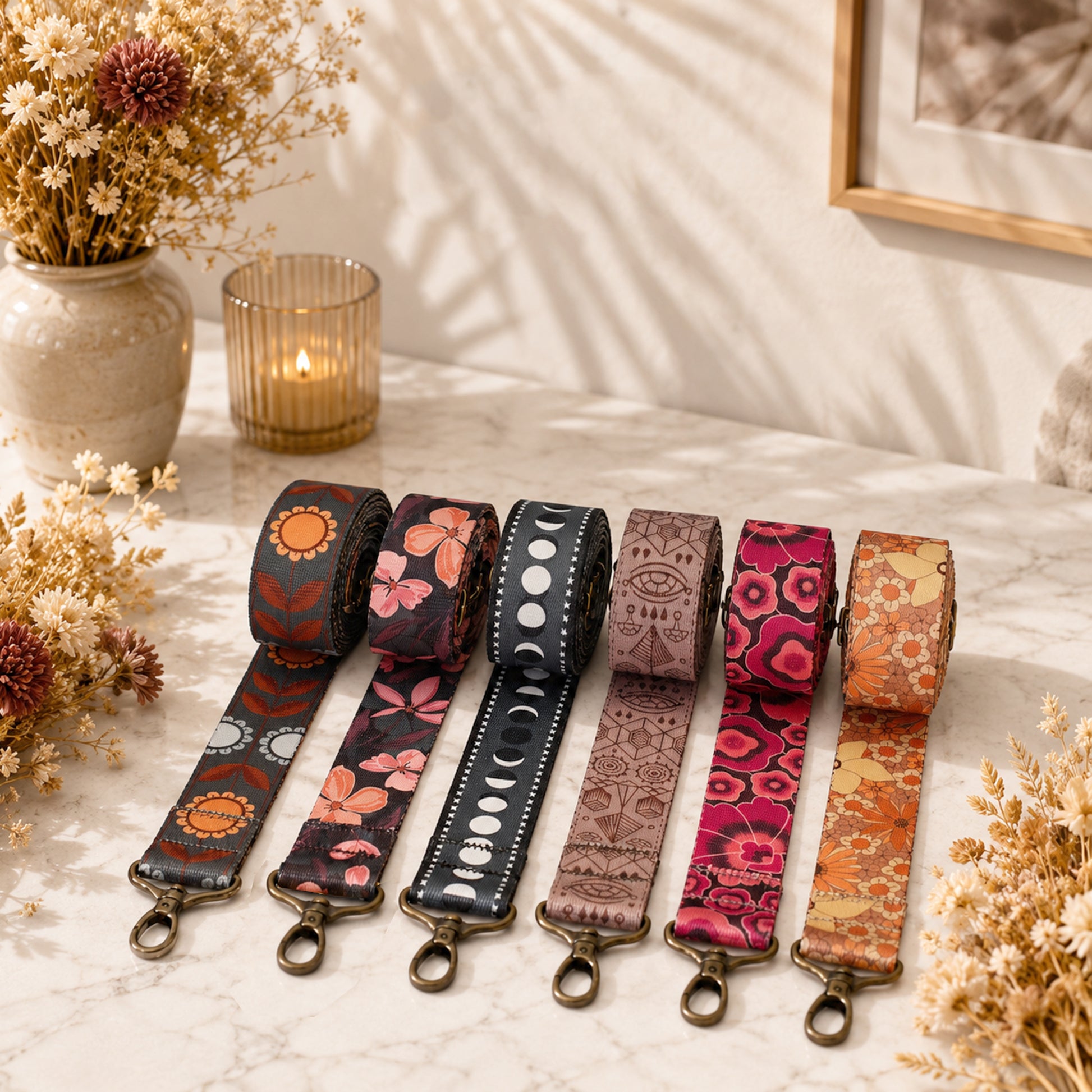 Set of colorful fabric straps on a marble surface with decorative elements.