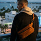 Person wearing personalized leather crossbody sling, street style shot