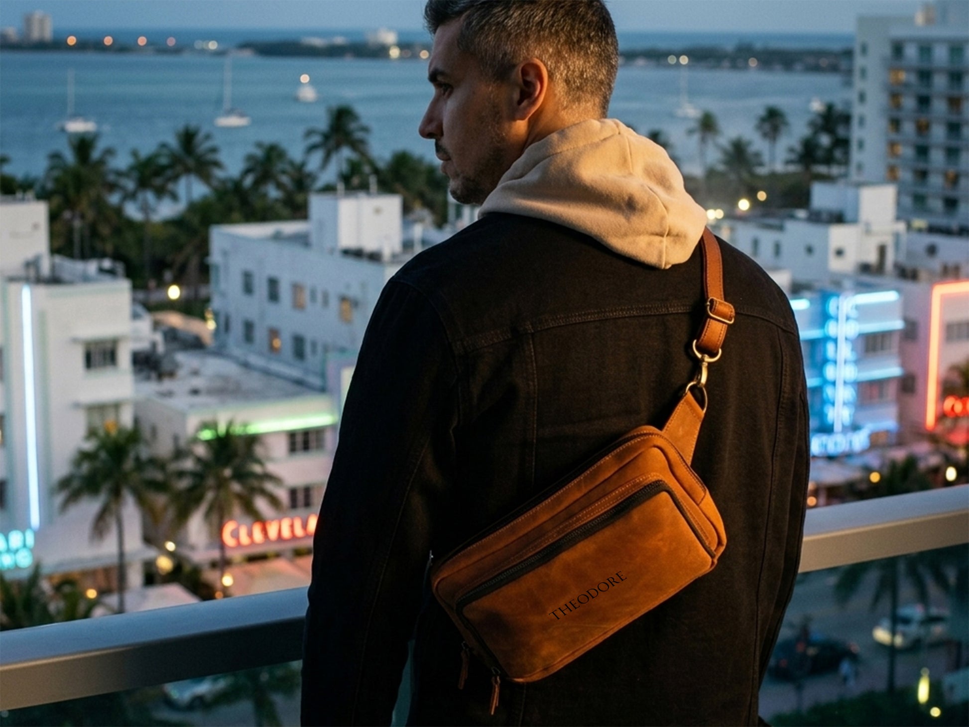 Person wearing personalized leather crossbody sling, street style shot