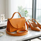 Natural leather handbag with warm patina, artisan craftsmanship