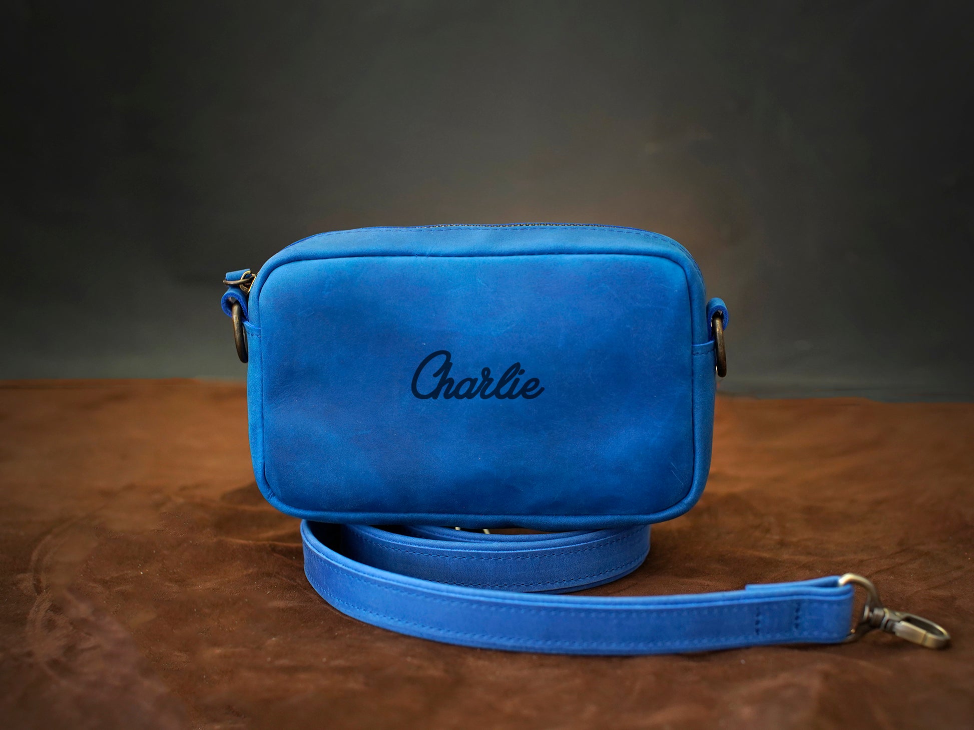 Personalized monogram engraving on handcrafted leather crossbody bag