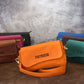 Leather crossbody pouch with custom monogram, magnetic quick-access closure