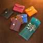 Person holding personalized leather jewelry pouch, lifestyle editorial photo