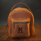 Interior of leather mini backpack, organized compartments for daily essentials