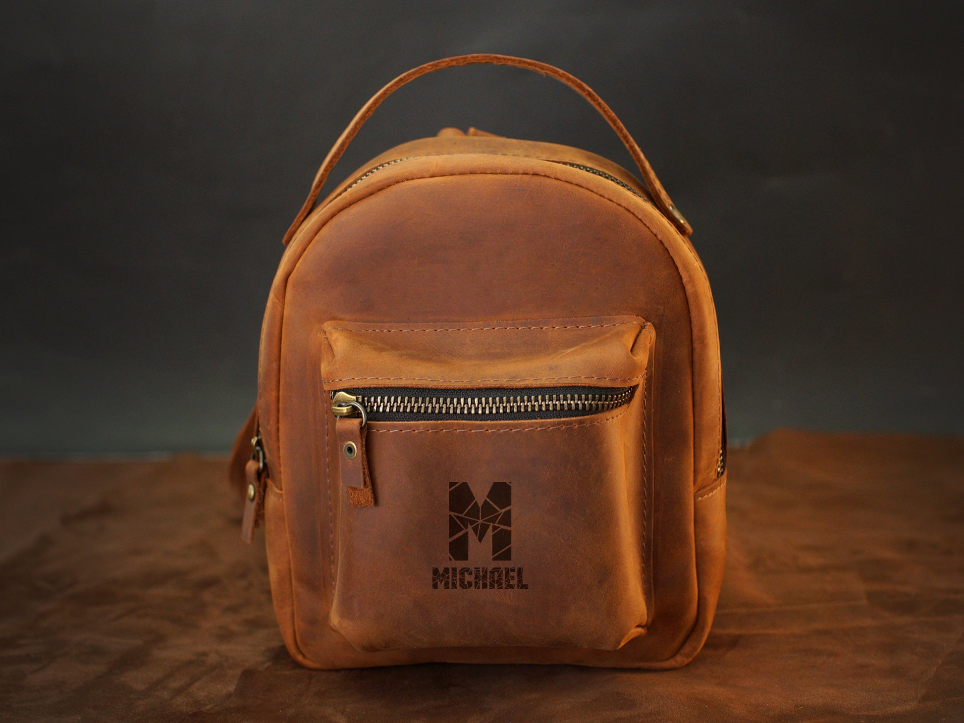 Interior of leather mini backpack, organized compartments for daily essentials