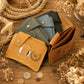 Person holding personalized leather AirTag wallet, lifestyle editorial photo