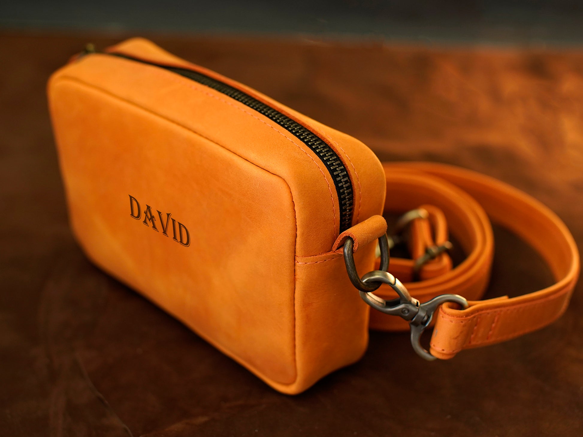 Personalized monogram engraving on handcrafted leather crossbody bag