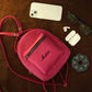 Leather mini backpack zipper and closure detail, durable brass hardware