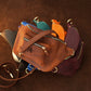 Person wearing personalized leather crossbody sling, street style shot
