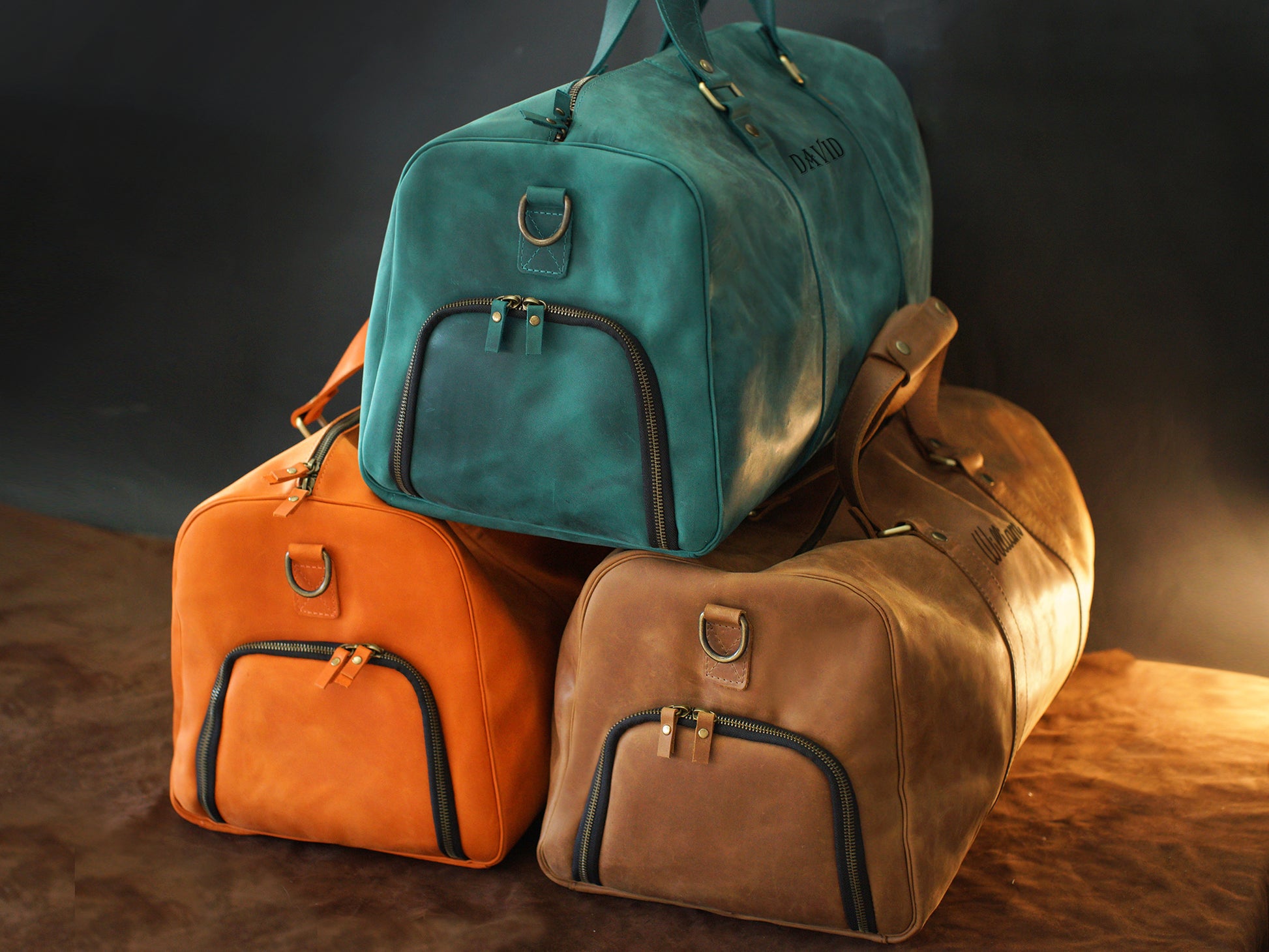 Person carrying personalized leather duffle bag, lifestyle editorial photo