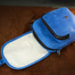 Blue pouch with a zipper on a brown surface