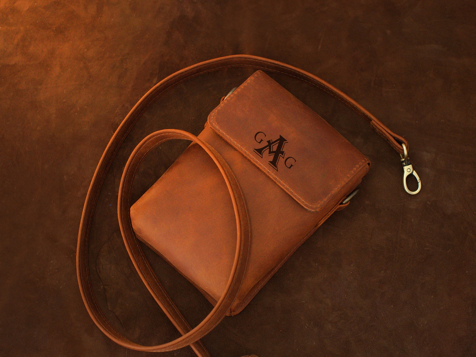 The Urban Explorer leather bag worn crossbody, warm earthy tones