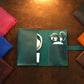 The Circuit Roll leather bag in use outdoors, warm earthy tones