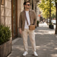 Man in a stylish outfit standing on a city street