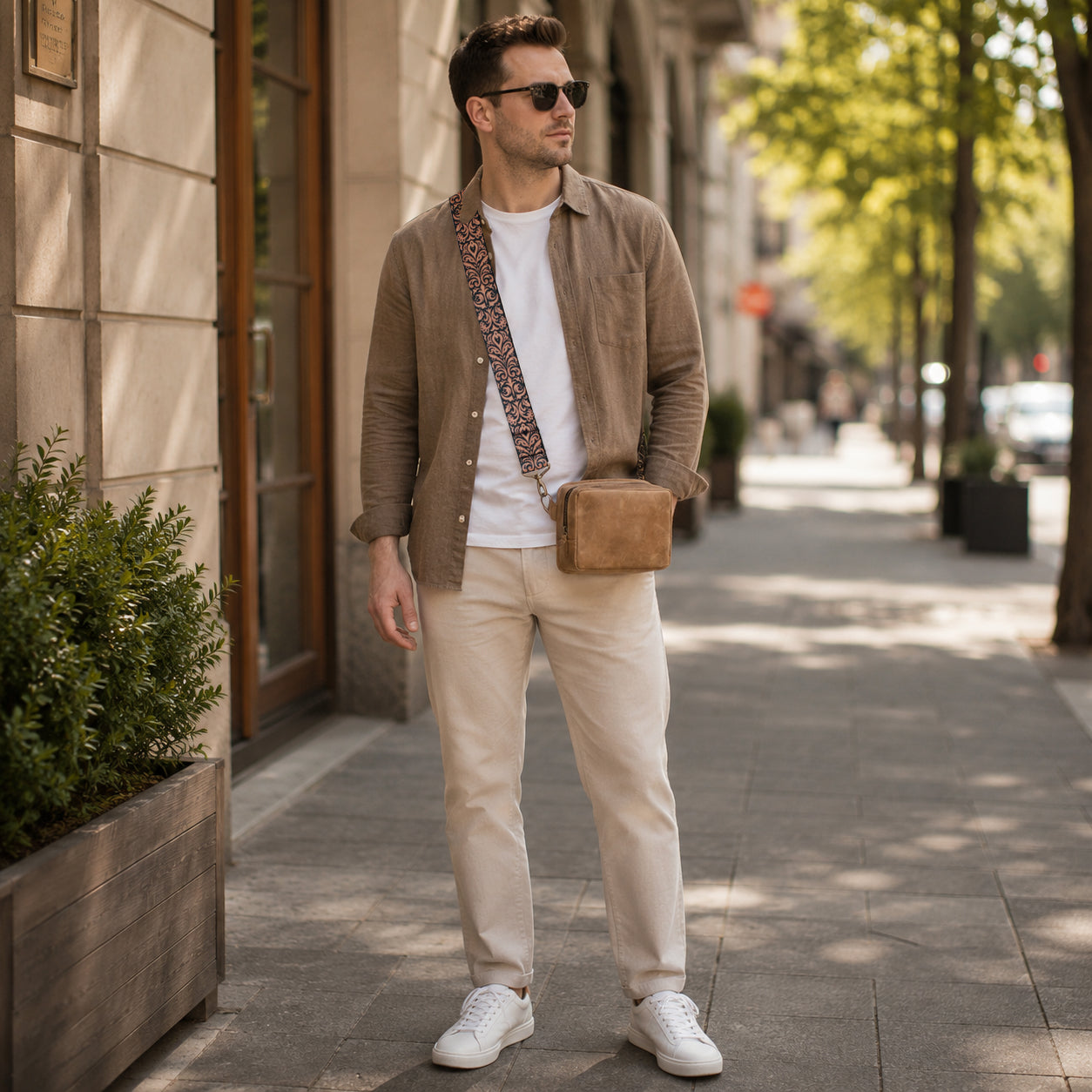 Man in a stylish outfit standing on a city street