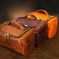 Large leather toiletry case with personalized engravings, collection flat lay