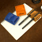 Collection of personalized leather pen holders with engravings