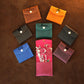 Collection of personalized leather jewelry pouches with engravings