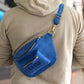 Leather crossbody sling with custom name engraving, warm brown tone