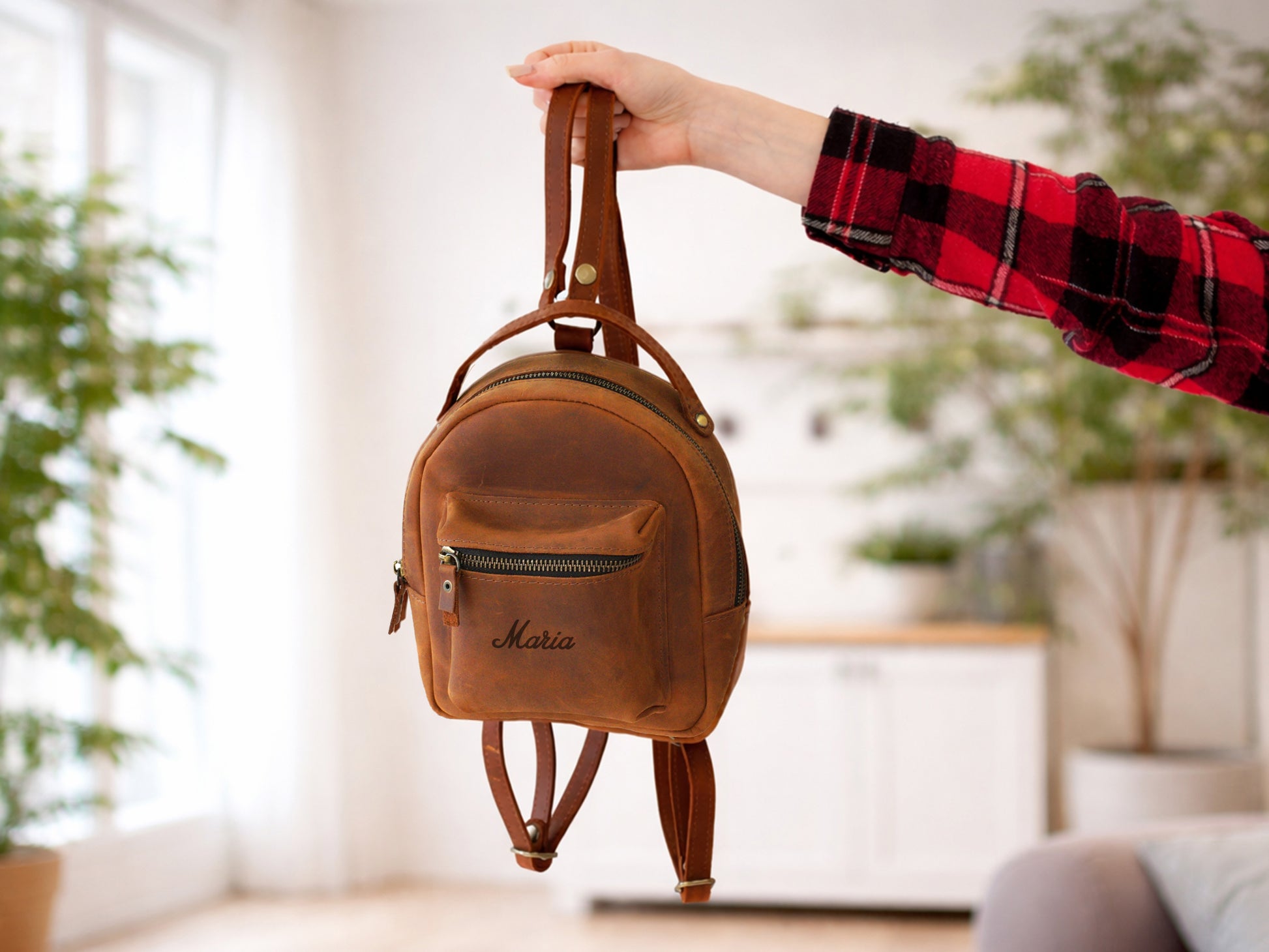 The Urban Petite leather backpack worn on back, lifestyle editorial photo