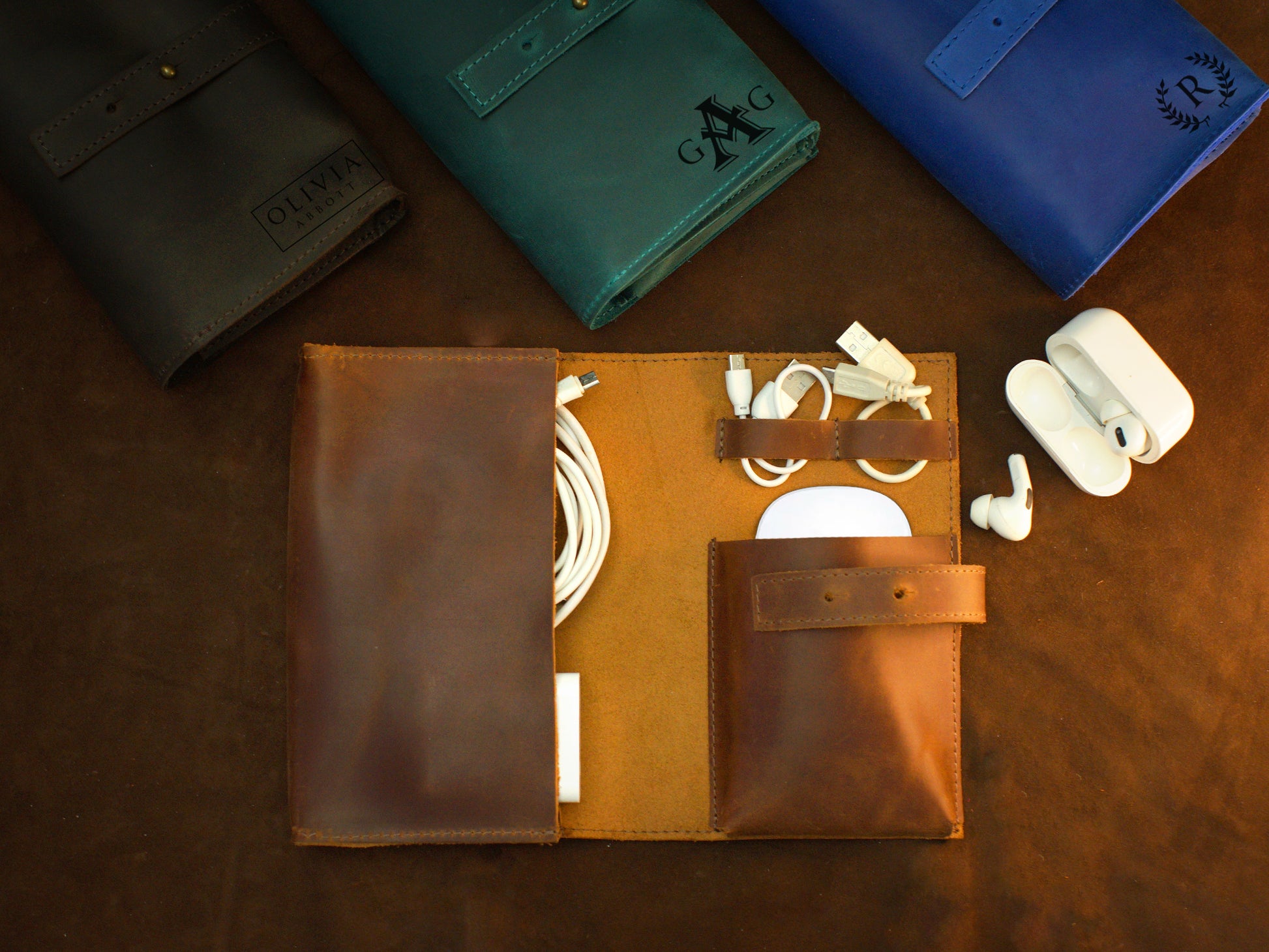 Collection of personalized leather cable organizers with engravings
