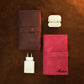 Multiple leather cable rolls with monogram initials on textured surface