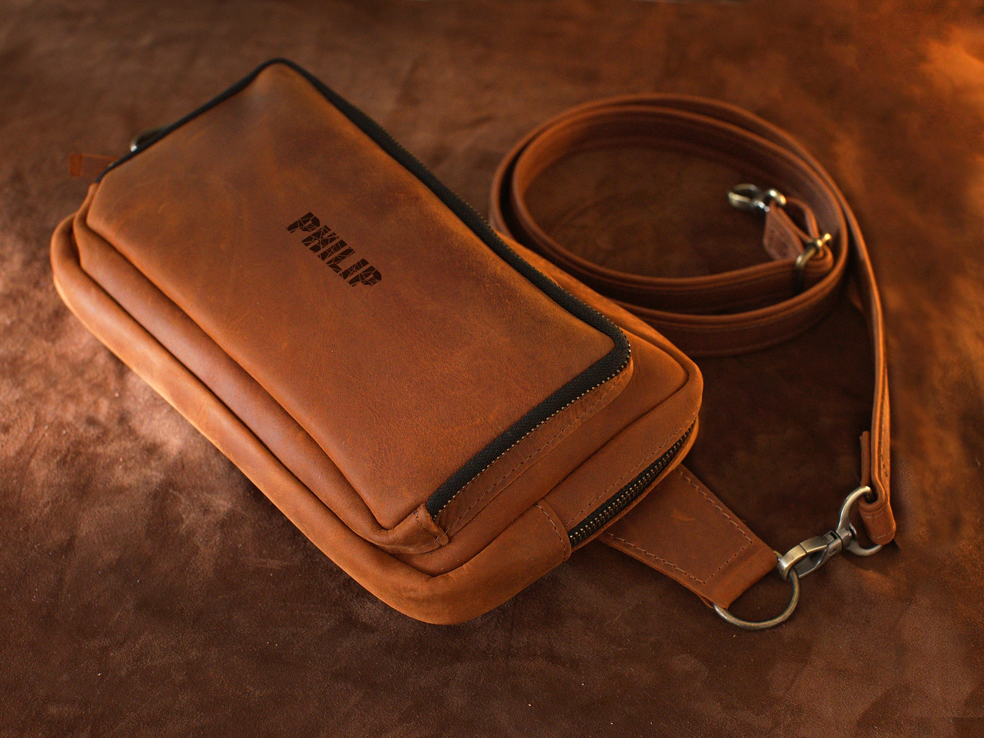 Handcrafted leather sling bag with monogram, gift-ready presentation