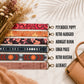 Set of colorful strap designs with names next to a brown handbag on a textured surface.
