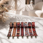Set of patterned straps on a marble surface with a soft, neutral background