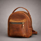 Leather mini backpack with custom name engraving, warm brown tone