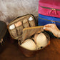 Multiple leather delicates cases with monogram initials on textured surface