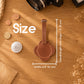 A brown leather luggage tag with a strap is shown on a wooden tabletop with overlaid size measurements reading 2.5 inches wide by overall length with strap around 5 inches.