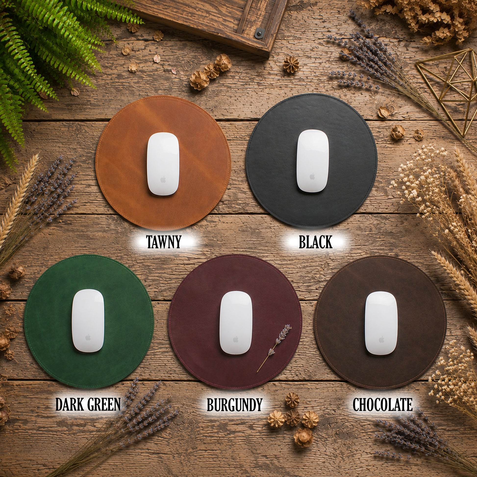 Five round mouse pads in different colors arranged on a rustic wooden surface: Tawny tan, Black, Dark Green, Burgundy, and Chocolate. Each pad is shown with a white computer mouse on top, with the color name printed below.