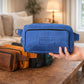 Leather crossbody bag collection with personalized engravings, lifestyle flat lay