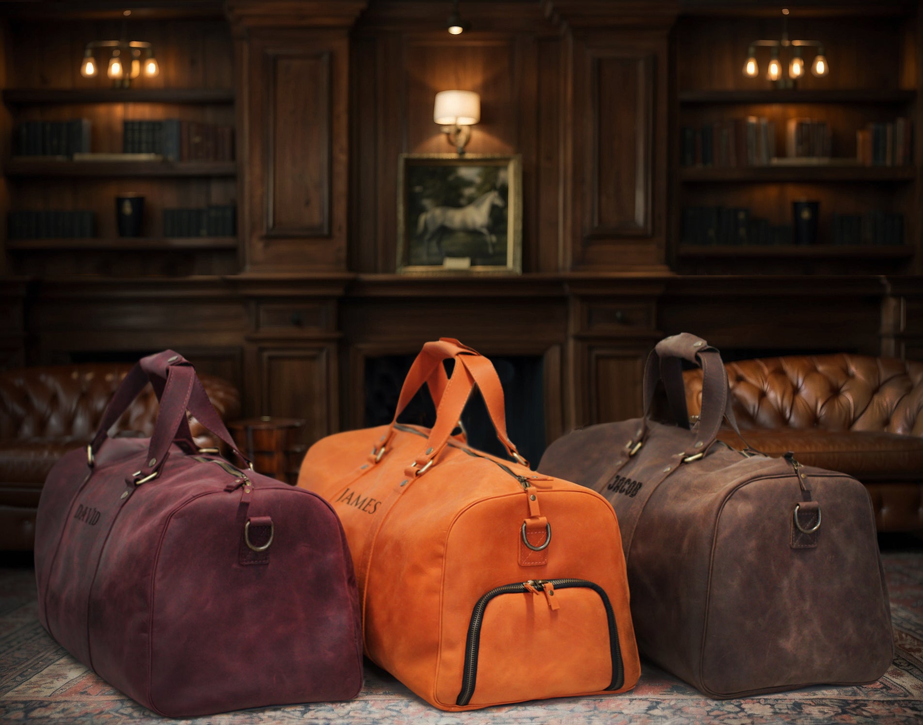 Three duffel bags in purple, orange, and brown on a patterned rug with a wooden panel background.