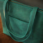 Brown leather zippered tote bag with custom monogram engraving, front view