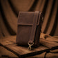 Brown leather bag on a wooden surface with a brown fabric background