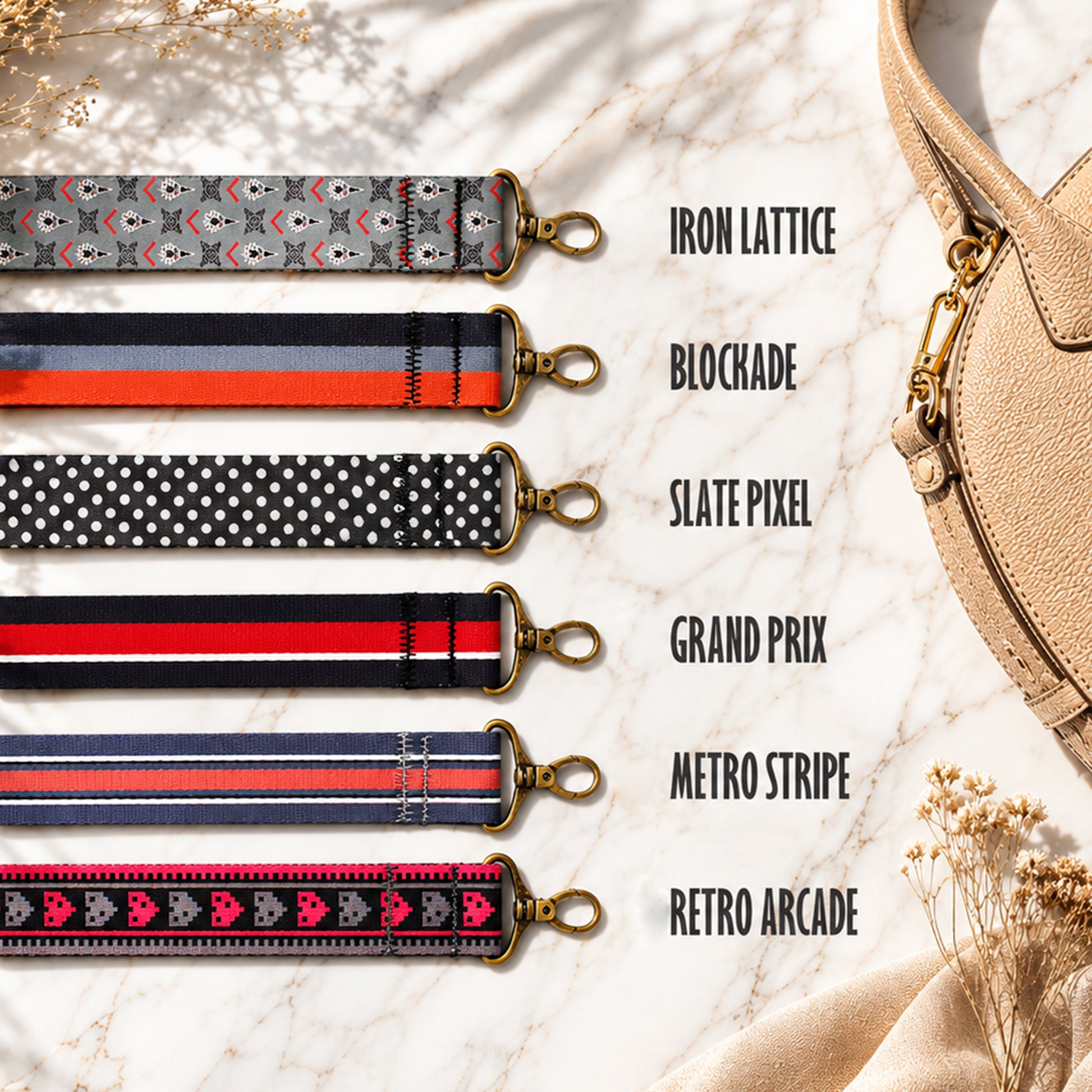 Collection of patterned strap designs with a beige handbag on a textured surface.