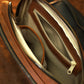 Brown leather crossbody bag with custom monogram engraving, front view