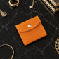 Minimalist leather jewelry pouch with wrap design, handcrafted