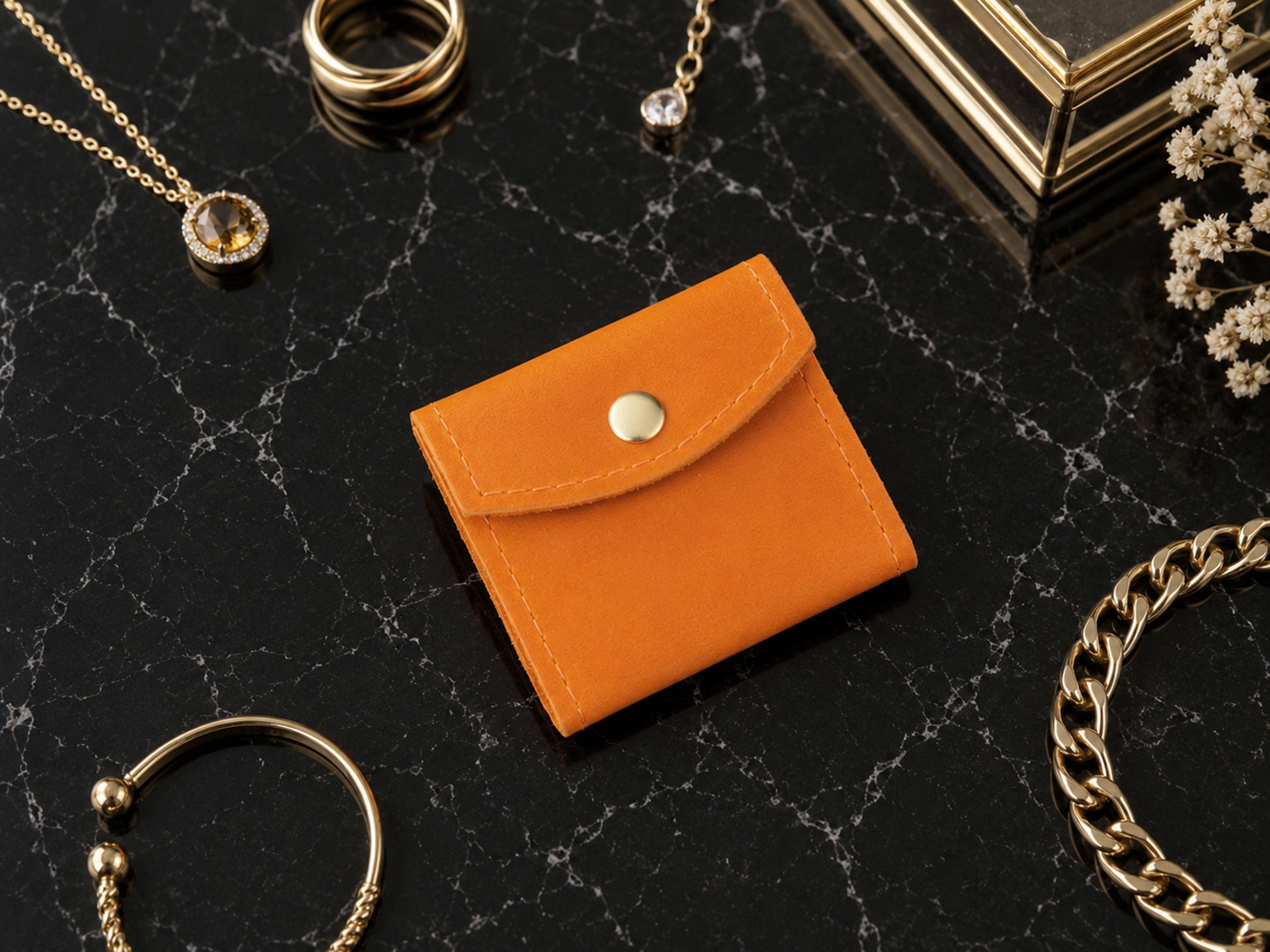 Minimalist leather jewelry pouch with wrap design, handcrafted