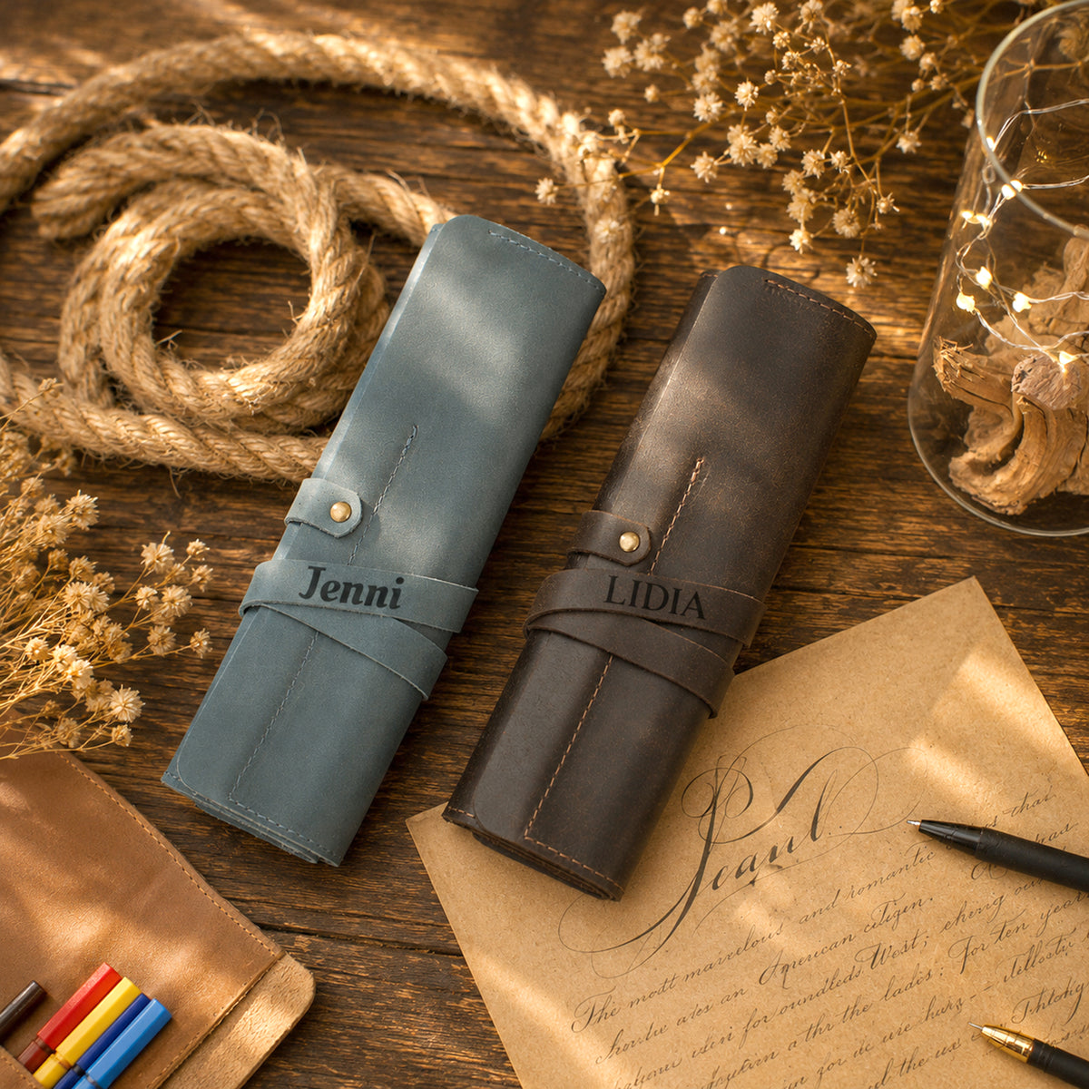 Brown leather pencil roll with custom monogram engraving, front view