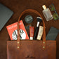 Minimalist leather tote bag with zipper closure, handcrafted design