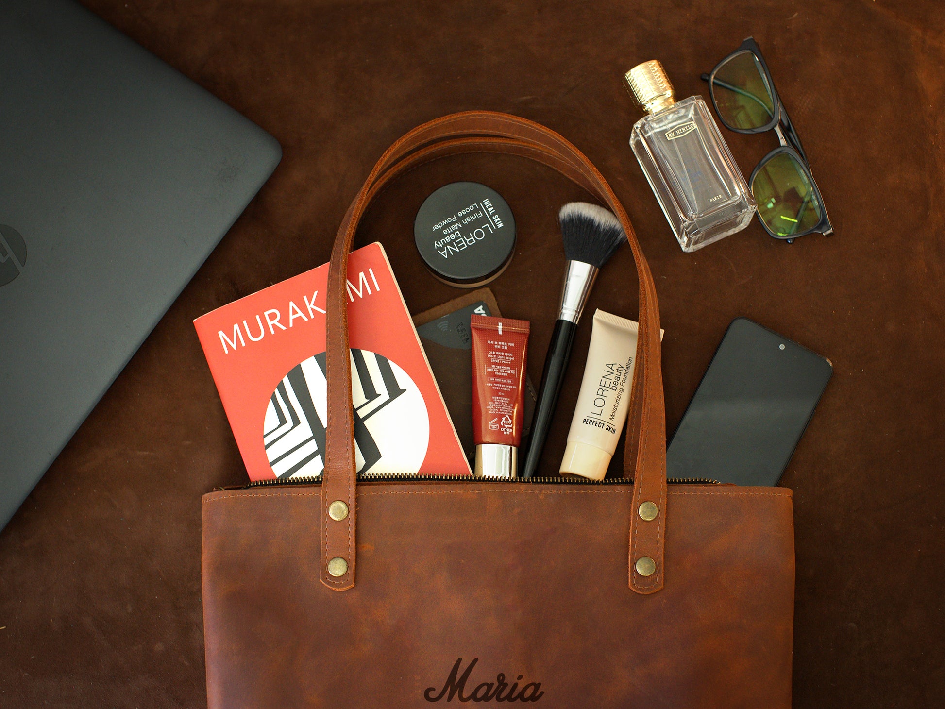 Minimalist leather tote bag with zipper closure, handcrafted design